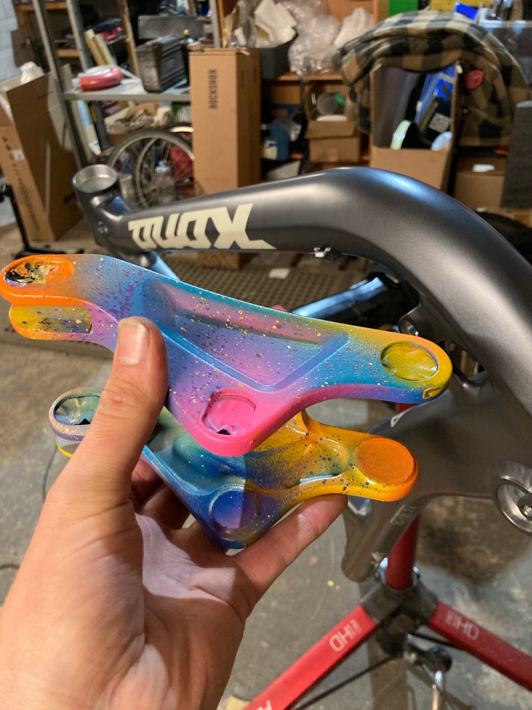 Finished rocker link in front of the front triangle, ready to prepare for paint